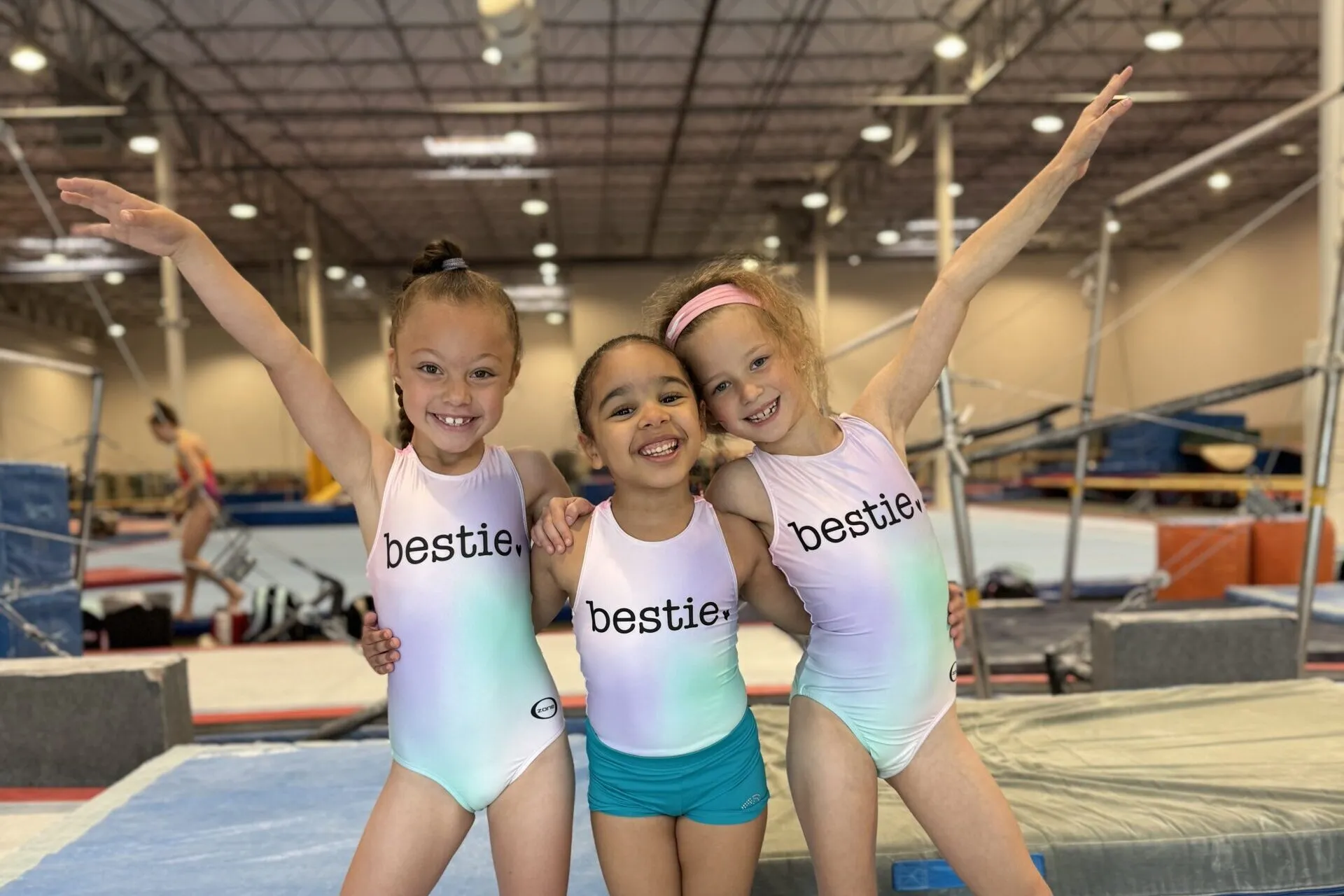 3 friends with bestie leotards smiling